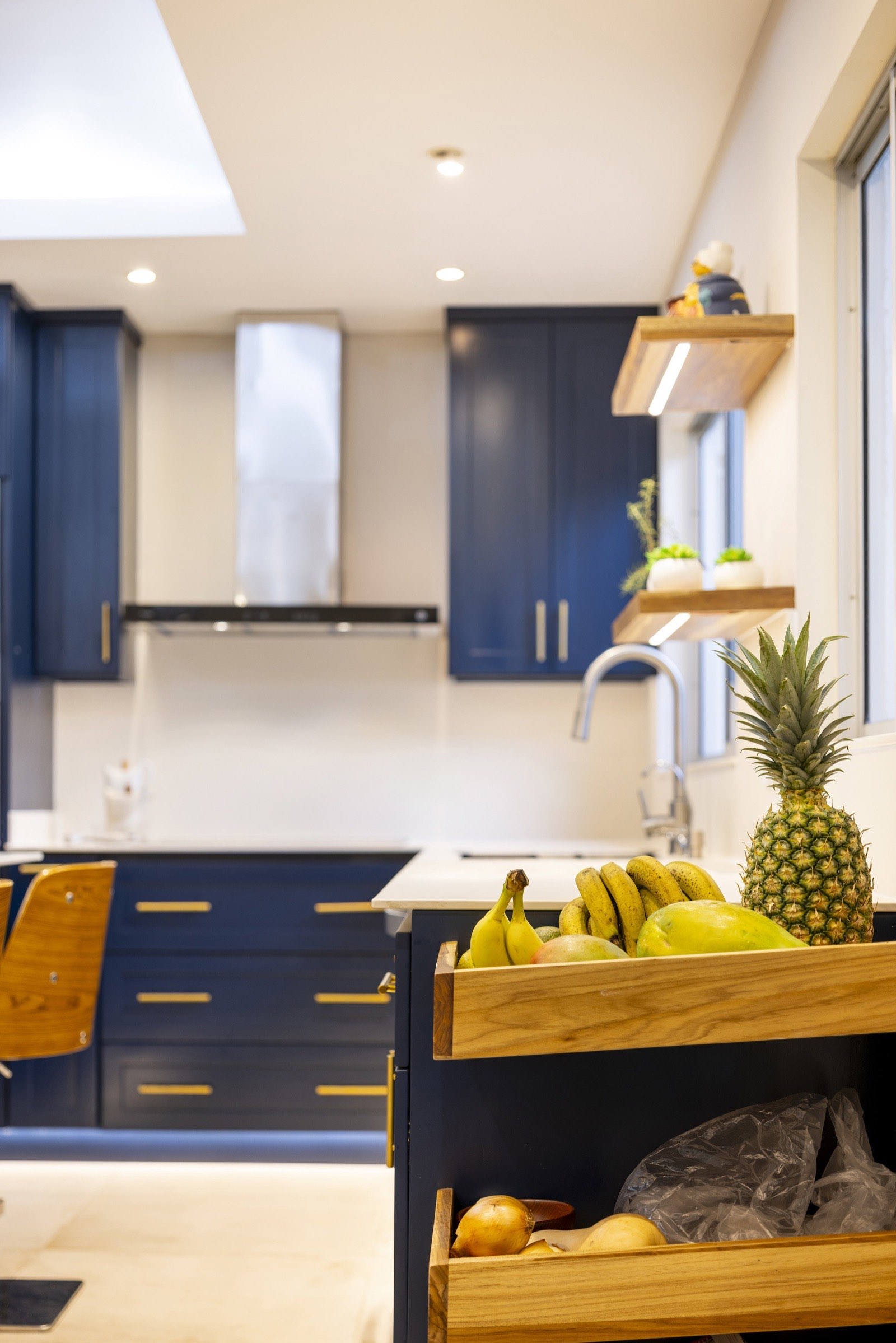 Open Laurel shelving and a window above the counter in the Jacamarca kitchen