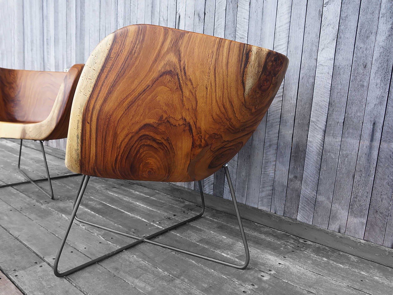Detail of the Pacífico chair — flowing Guanacaste grain and live-edge rim
