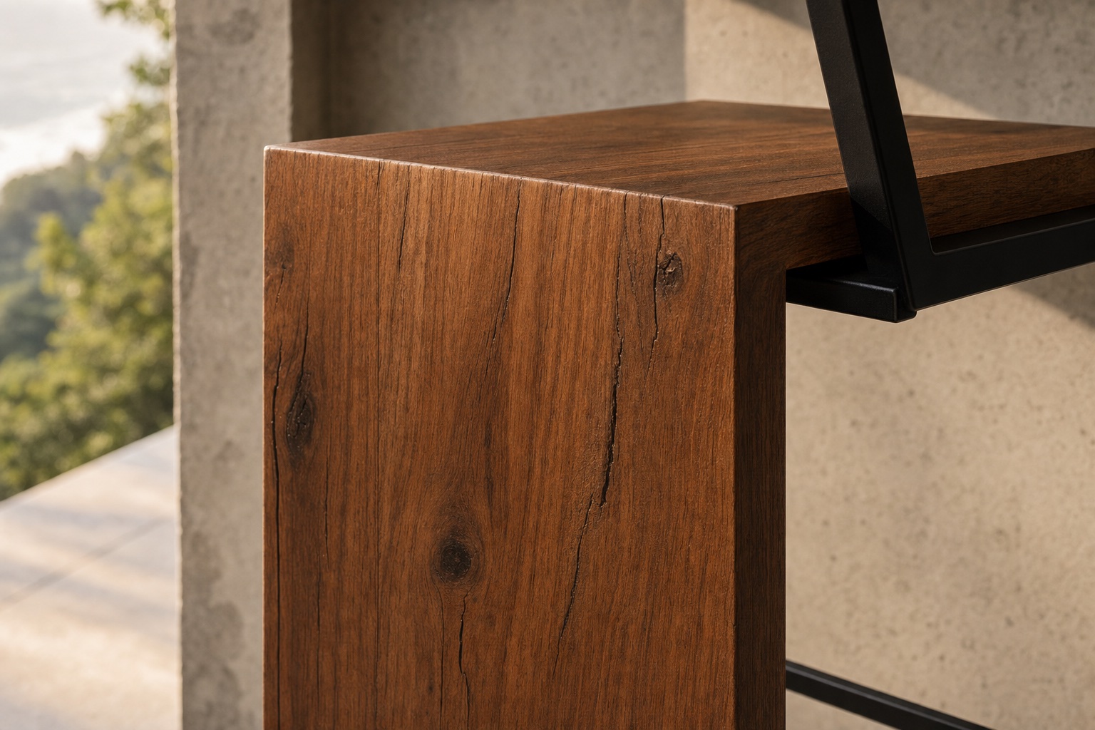 Detail of the Guanacaste grain wrapping the waterfall edge into the black steel frame