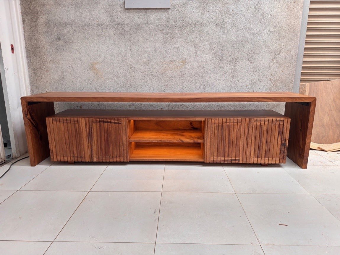 Custom fluted media console in solid Guanacaste wood by Bernardo Urbina