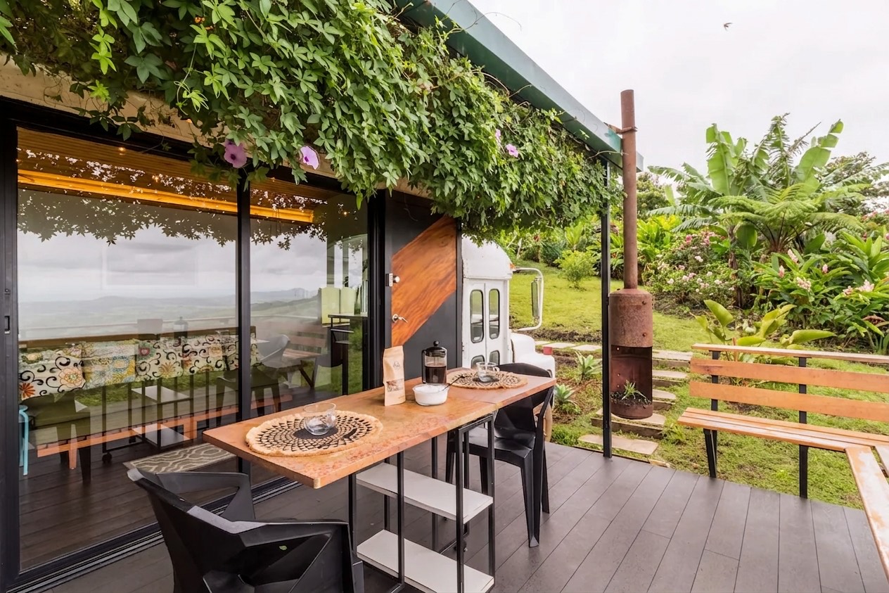 Sunset Retreat converted bus with outdoor breakfast deck
